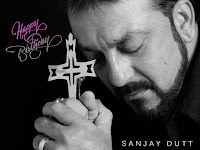 sanjay dutt, black and white picture with closed eyes and holy cross