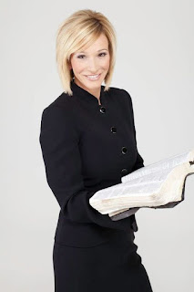 Paula White holding an open book