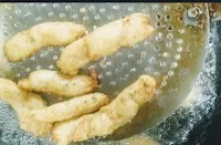 Crisp golden fried fish fingers in oil for fish fingers recipe