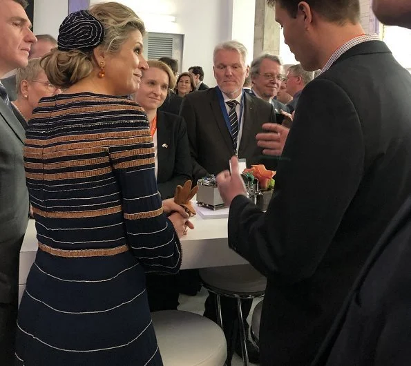 Queen Maxima wore Jantaminiau cape coat and dress