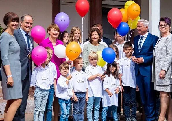 Queen Silvia and German First Lady Elke Buedenbender at the opening ceremony of Child House