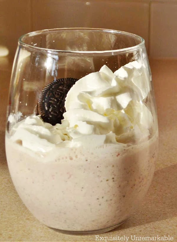 Oreo Banana Smoothie with whipped cream in a glass