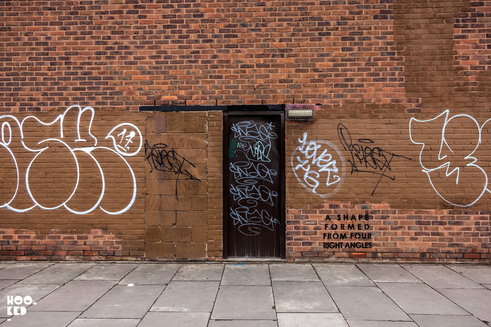 Text based stencil street art in Hackney Wick , London by artist MOBSTR