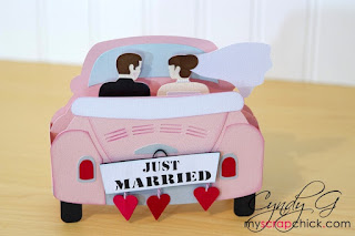 3d Card in the shape of a car with married couple
