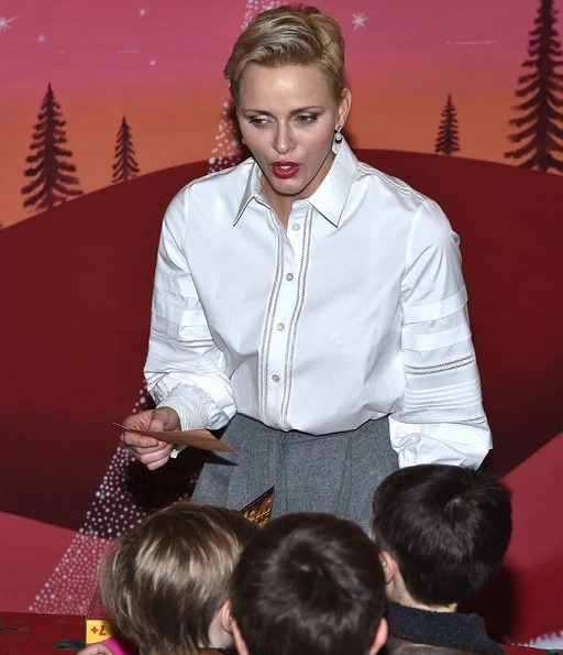 Prince Albert, Princess Charlene, Prince Jacques and Princess Gabriella attended the Children's Christmas ceremony and the Christmas gifts distribution at the Monaco Palace.