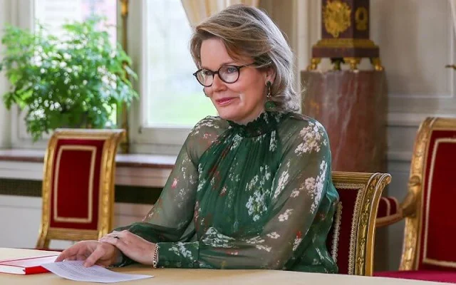 Queen Mathilde wore a floral print lapelless jacket from Giorgio Armani, and a floral print tulle dress from Natan