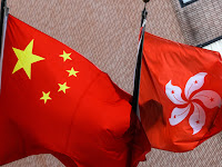 China approves Hong Kong electoral system reform bill.
