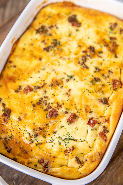 Low Carb Taco Casserole - low on carbs but high on taste! SO good! Everyone cleaned their plate and asked for seconds!! Ground beef, taco seasoning, diced tomatoes and green chiles, cheddar cheese, eggs, sour cream, and heavy cream. It is like a quiche without the crust. Ready in 30 minutes. Can make ahead and refrigerate or freeze for later. #casserole #freezermeal #taco #mexican #lowcarb #keto #glutenfree taco casserole in baking dish