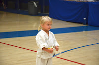 Taekwondo for toddlers as a little girl gets ready to perform at a martial arts tournament