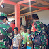 TNI dan Relawan Pendidikan Bagikan Bingkisan Natal Kepada Anak-Anak Papua