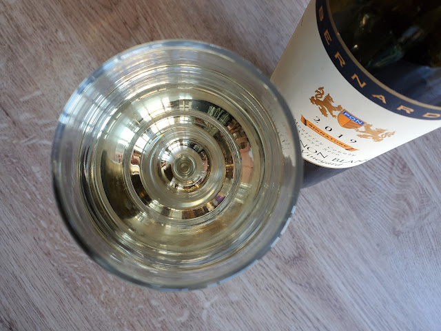 Image of a glass of white wine from the top of the glass