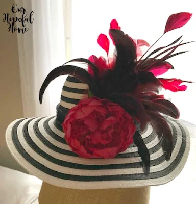 straw hat red peony red feathers