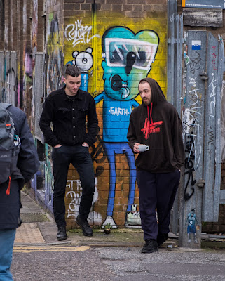 two men chatting, graffiti, East London, street art