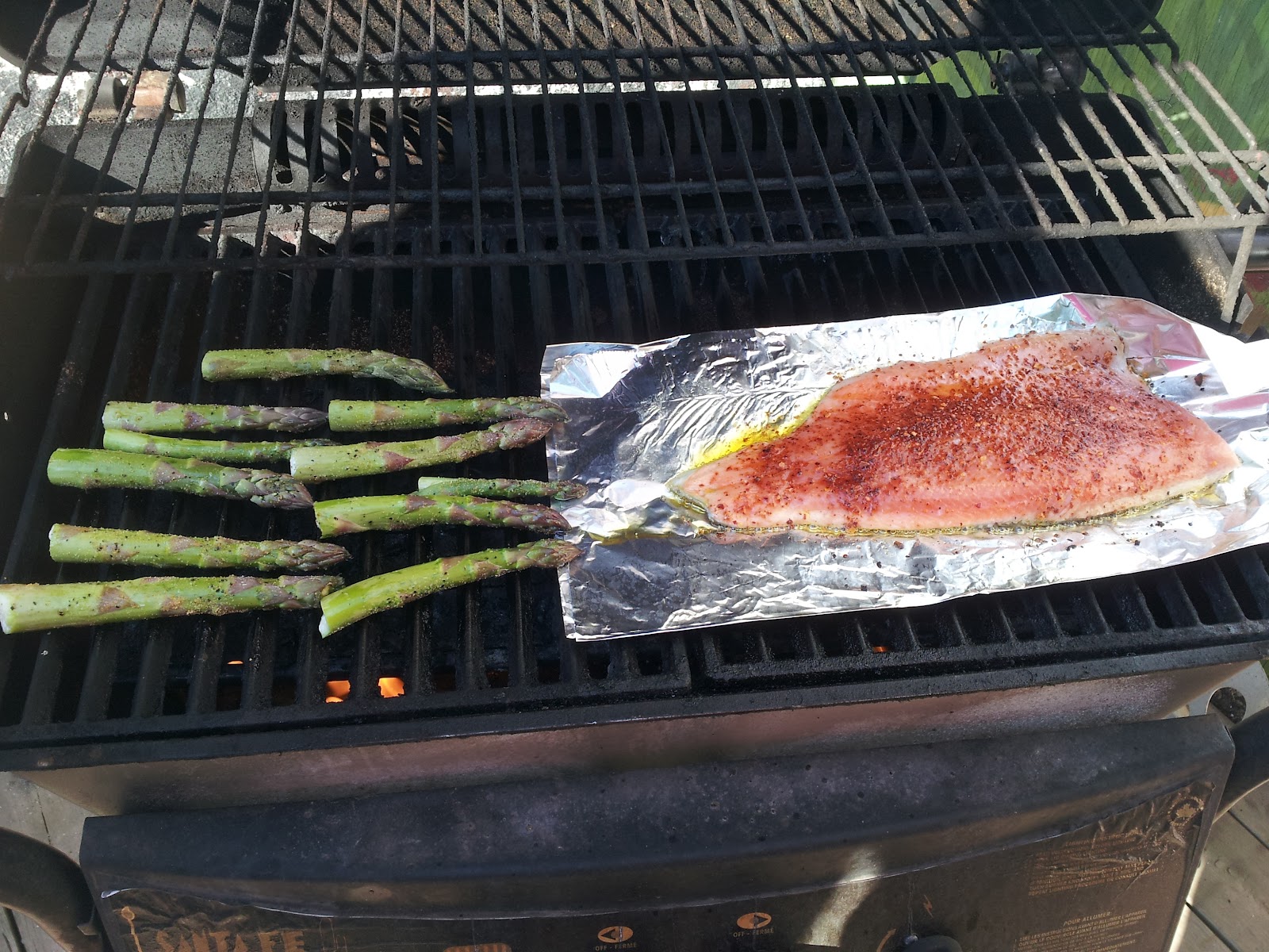 Poonapalooza Cajun rainbow trout with grilled asparagus and coleslaw