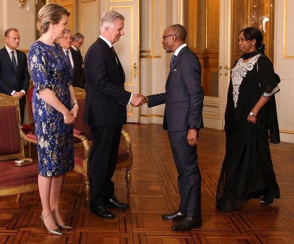 Queen Mathilde wore Dries Van Noten A-Line metallic floral jacquard midi dress. European Union, and the foreign diplomats