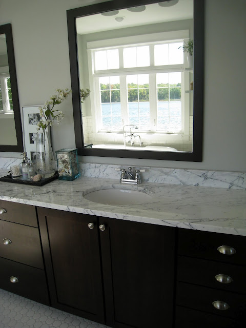 A bathroom with a sink and a window