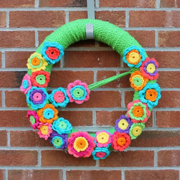 Crochet bright color flowers and turn it into a wreath