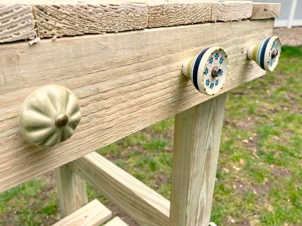 Ceramic knobs on a DIY potting table