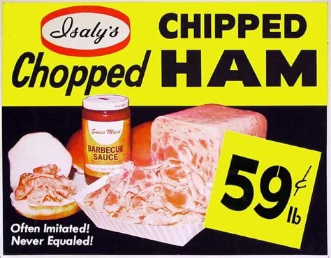 Vintage ad for Isaly's Chopped Ham with picture of BBQ sauce and shaved ham loaf with an image of chipped ham on a bun. "often imitated, never equaled!"