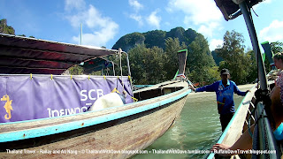 Coming to shore in longtail boat by Railay West