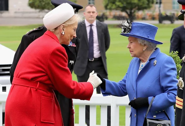 Britain's Queen Elizabeth II is greeted by Prince Michael of Kent during a visit to the Honourable Artillery Company in London.