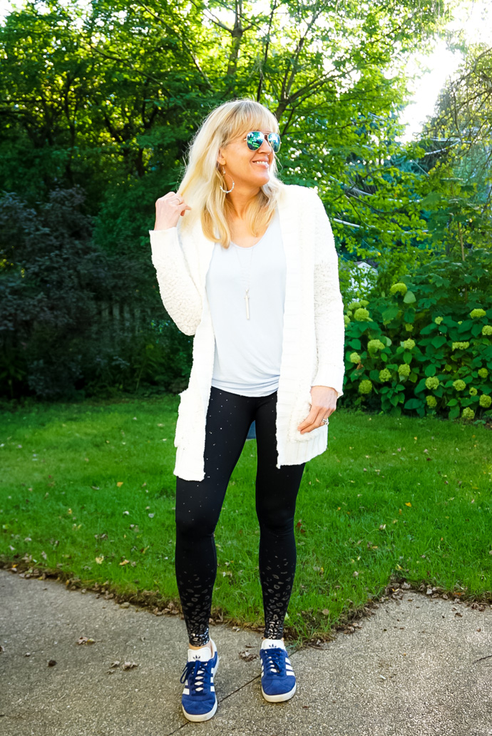 cozy leggings outfit idea with white sweater and black leggings