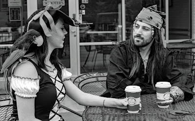 Pirates relaxing outside Scooter's Coffee Shop