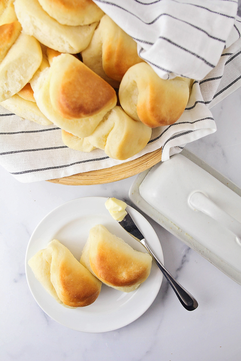 These Parker house rolls are so tender and soft, with the perfect light texture and buttery flavor!