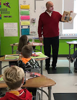 Superintendent reads  to elementary students