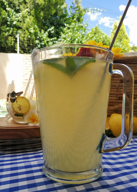 Home-made Lemonade, home-made, lemonade, lemonade recipe, picnic, pool side, drinks, summer, summer drinks, drinks recipe, food photography, drinks photography, weekend vibes, food blog, food blogger, spicy fusion kitchen, mr price home, bee, bees tumbler, kenwood, pinterest, sunflowers, flowers, lemons, mint,  roses, botswana
