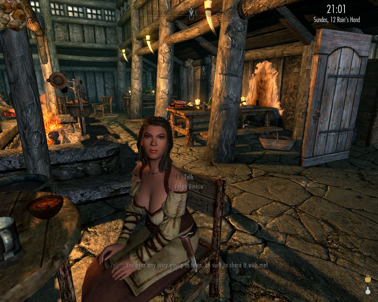 Valga sits in the taproom on a chair with her hands on her lap, looks up to the protagonist