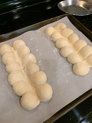 Two sets of 6 breads set to rise