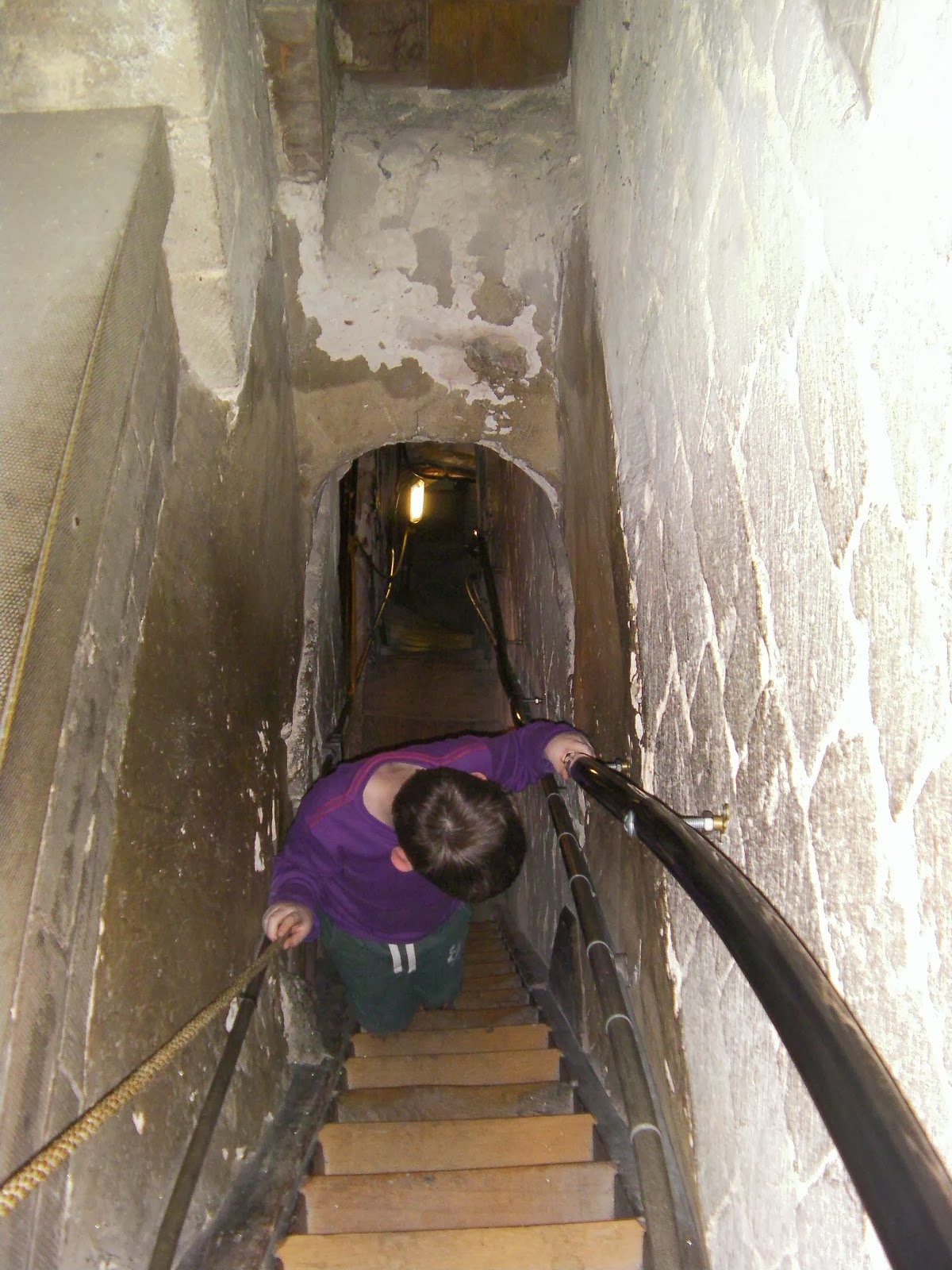 narrow stone staircase to bellringers room in romsey abbey tower have to go backwards down narrow medieval staircase