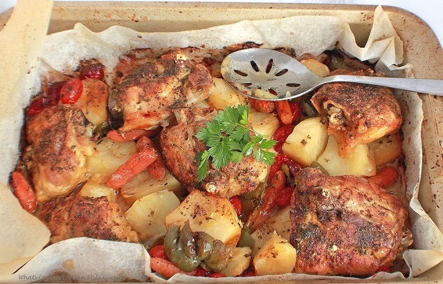 this is a casserole with chicken carrots, peppers and potatoes.