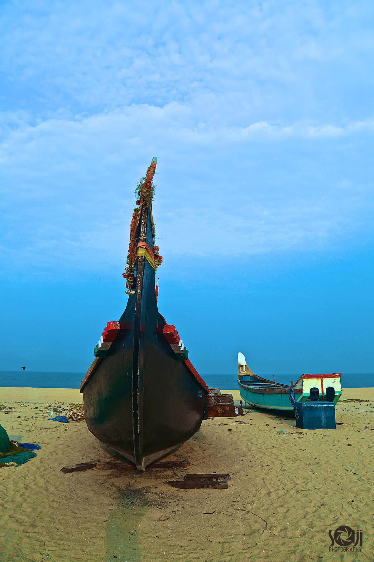 Boats at Chethi Beach, Kerala high resolution free