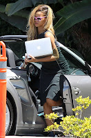 Rihanna carrying a laptop