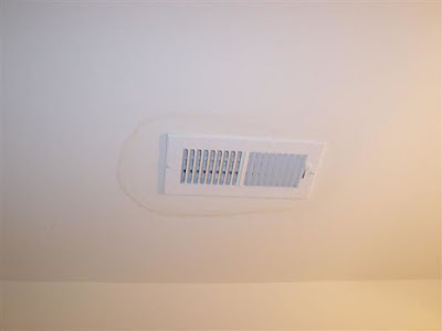 Moisture stains around vent cover on Florida ceiling 1homeinspector.com