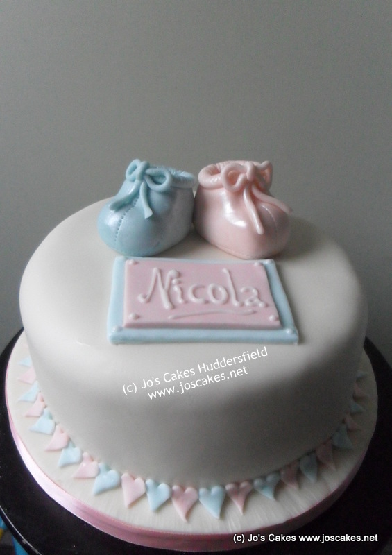 The cake was finished with a border of hearts in alternating blue and ...