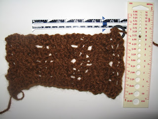 A swatch of the alpaca yarn with rules across the top and down the side.