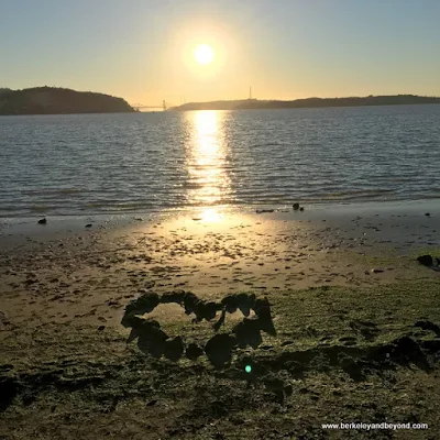 sunset at Benicia waterfront with rock heart in Benicia, California