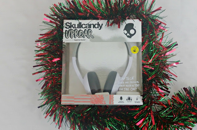 Skullcandy Uproar headphones in box with tinsel round it.