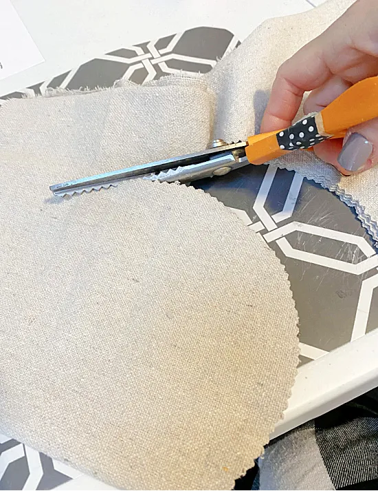 cutting a heart from drop cloth fabric