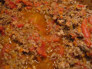 close up of meat sauce cooking in pot