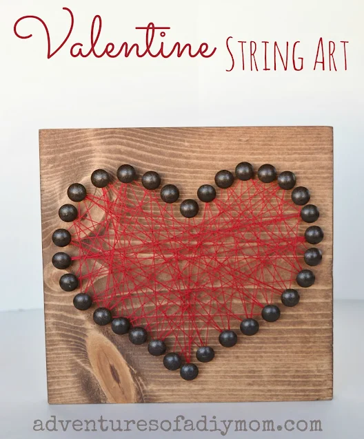 heart string art using wood, upholstery tacks and string