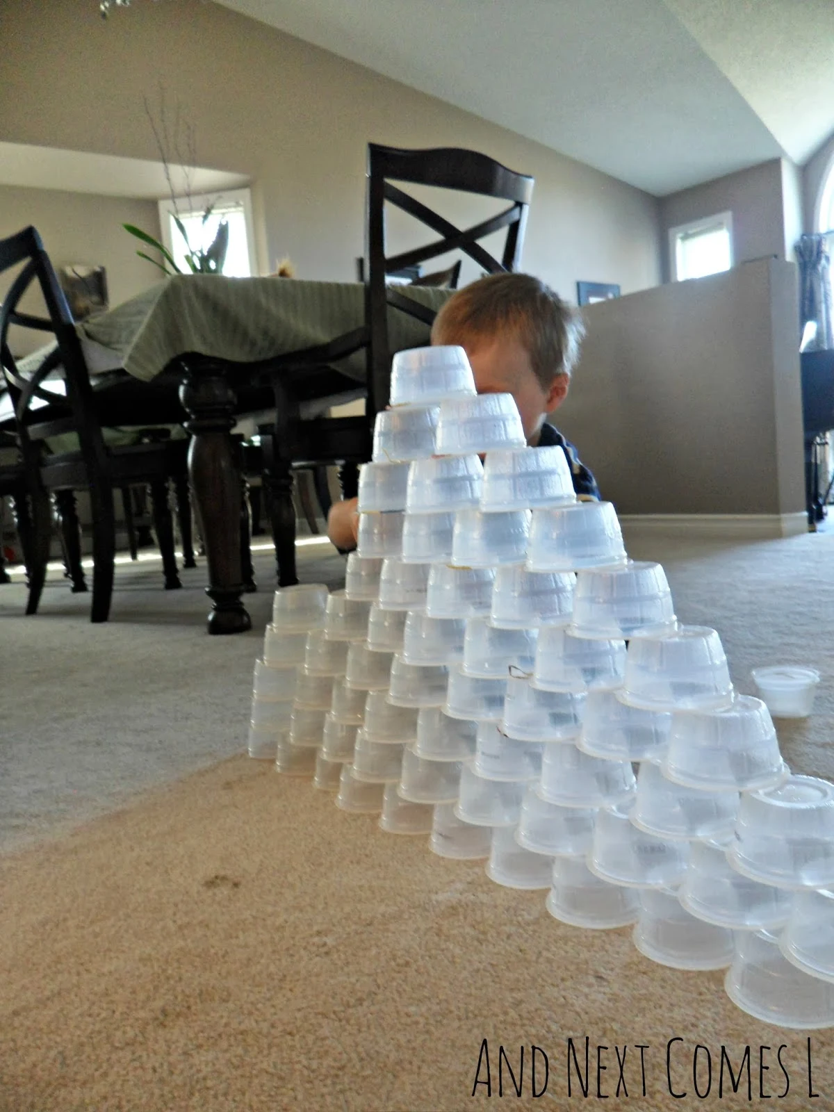 Building a tower out of recyclable containers from And Next Comes L