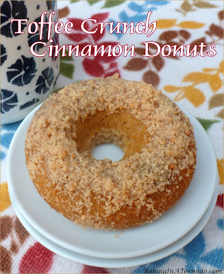 Toffee Crunch Cinnamon Donuts, these baked donuts can be on the table in ½ hour. Mix, bake, add the crunchy topping and they’re done. | recipe developed by www.BakingInATornado.com | #recipe #breakfast