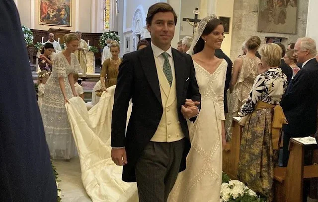 Princess Marie Astrid wore the Kinsky Honeysuckle tiara from the collection of the Princely Family of Liechtenstein. Wedding dress