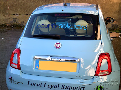 County Solicitors vehicle livery, the logo is in the back window. On the bumper 'Local Legal Support in blue' with two 'The Law Society' logos.