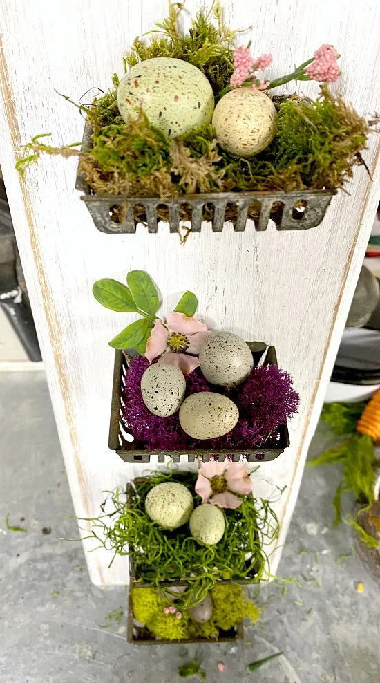 Repurposed cutting board soap baskets with colored moss and eggs