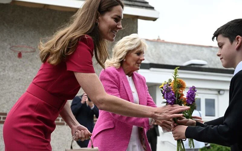 Kate Middleton wore a new midi pencil dress from Alexander McQueen. US First Lady Jill Biden wore a pink tweed blazer from L'agence